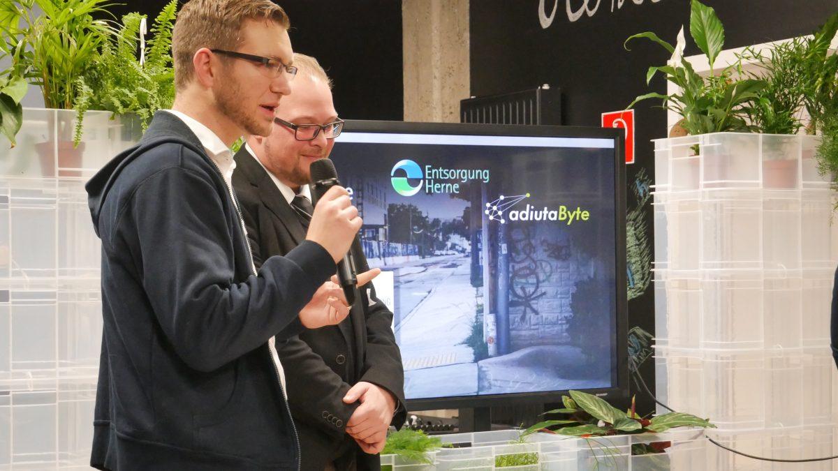 Speaking on the mic is Adiutabyte Co-Founder Dustin Feld