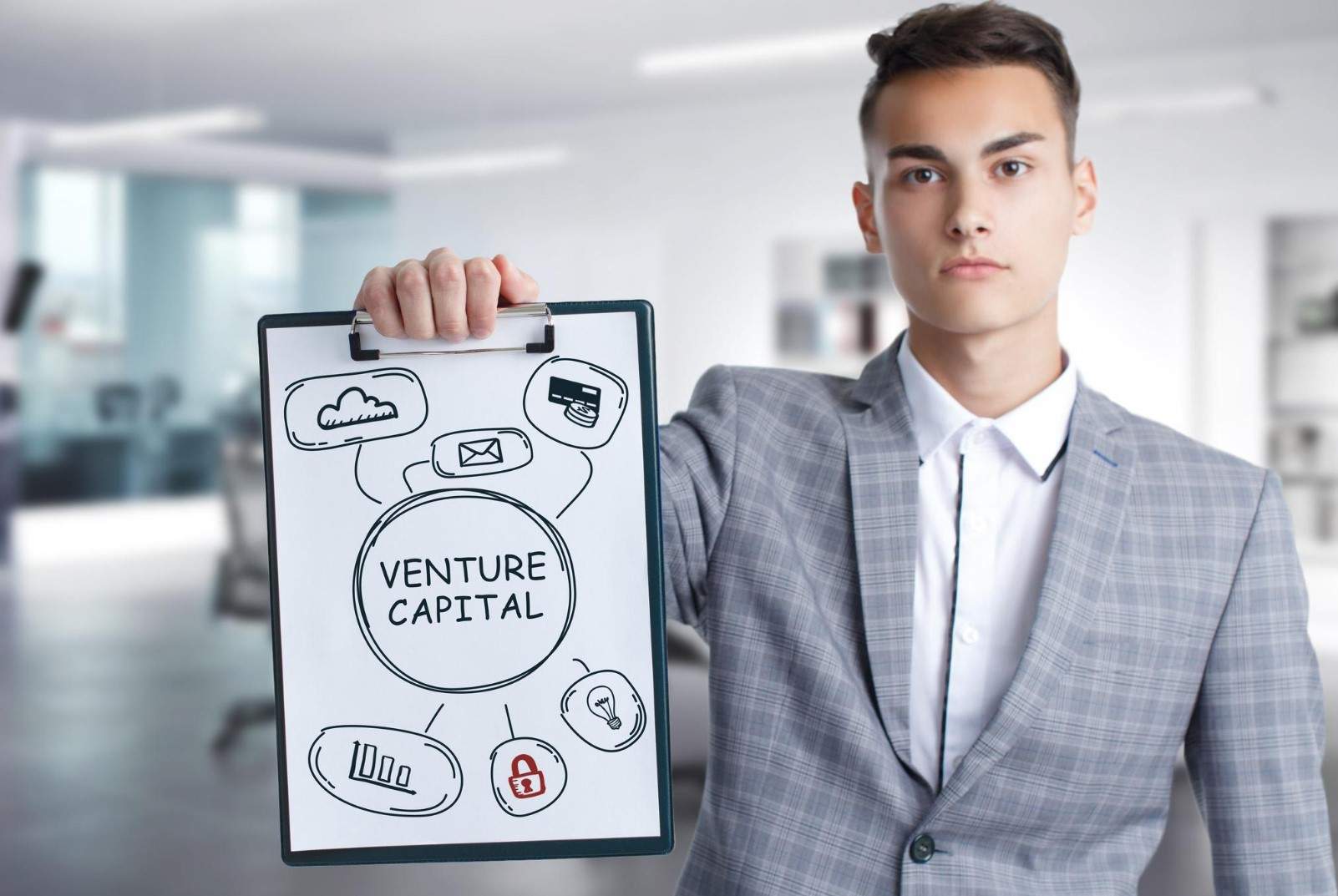 A man holding a notepad