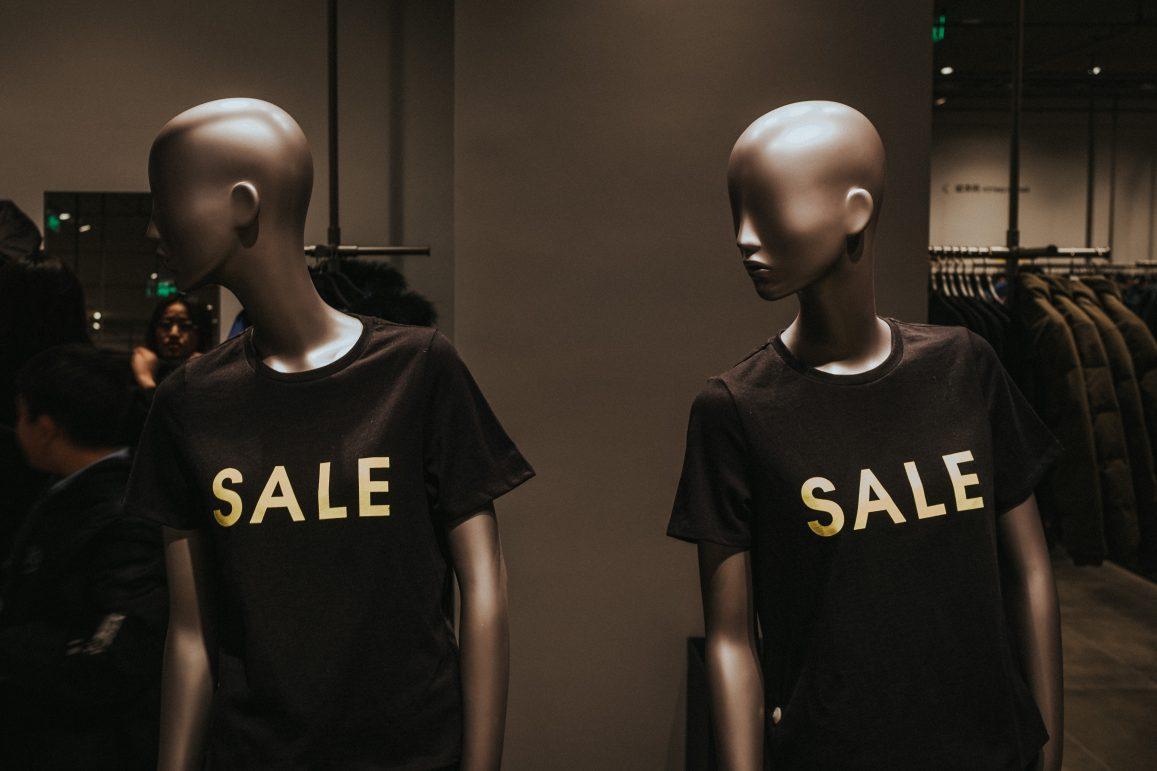 Mannequins wearing black shirts